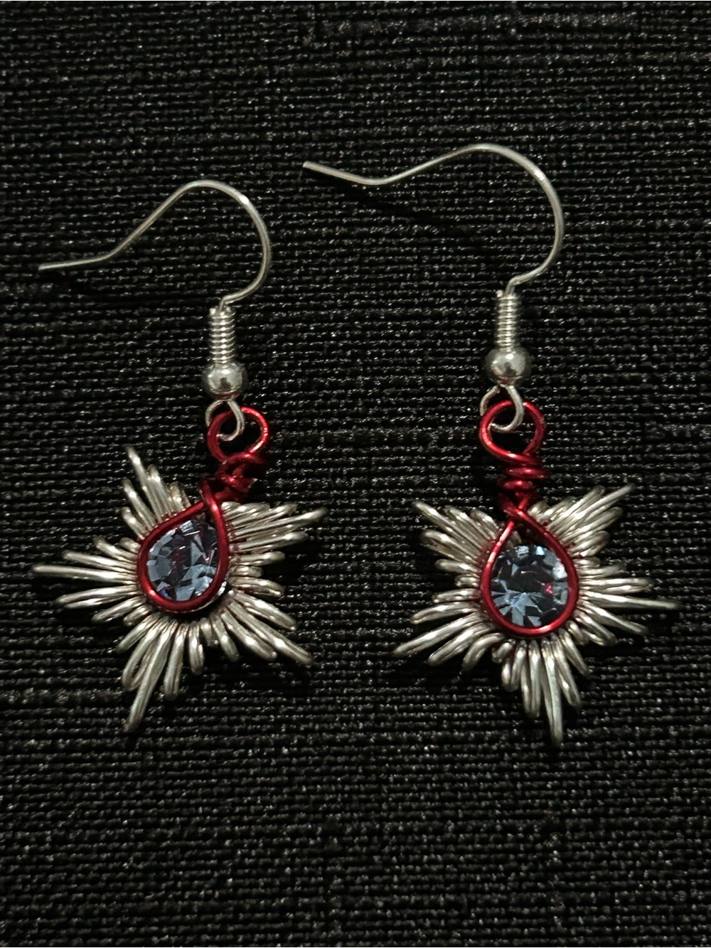 Handcrafted Silver Starburst Earrings with Blue Crystal and Red Accent
